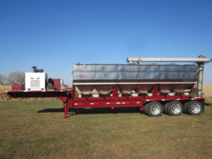 Overhead discharge trailer mounted fertilizer tender